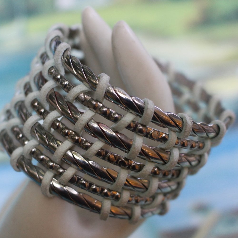 7 Bangle Bracelets Intertwined For a Cuff Bracelet